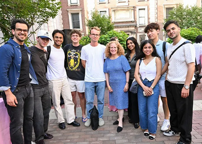 President Mnookin poses with GSAPP students at a summer gathering.