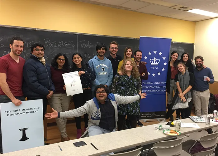 Allia Mohammed (center) poses with the SIPA Debate and Diplomacy Society. 