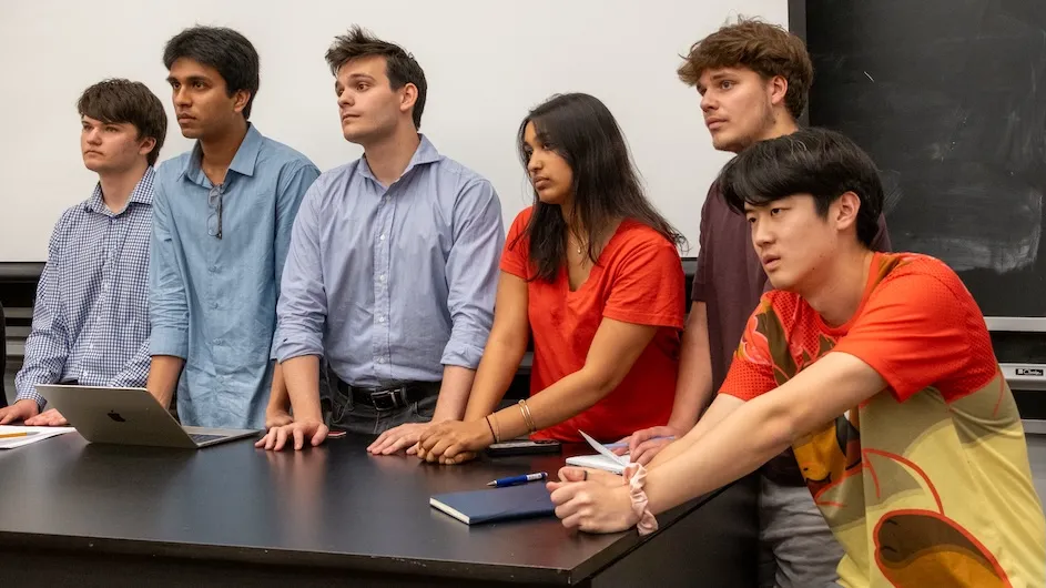 Student debaters listen to a speaker at a recent BridgeColumbia-hosted debate between the Columbia University Democrats and the Columbia University College Republicans. (Credit: William Kim)