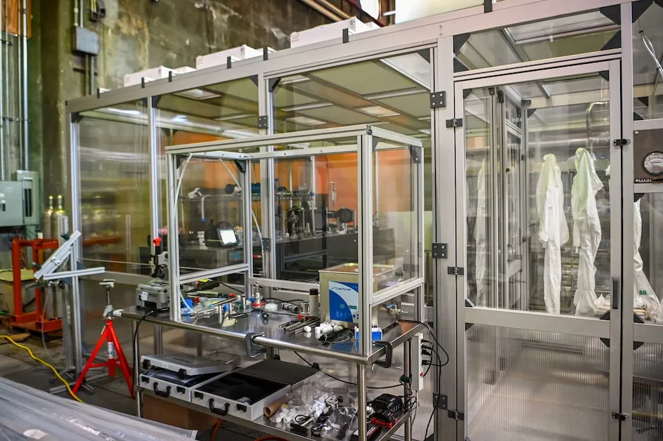 Suits hang outside the Nevis cleanroom.