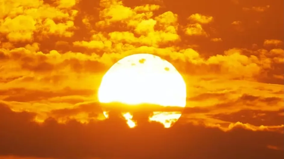 The sun behind clouds.