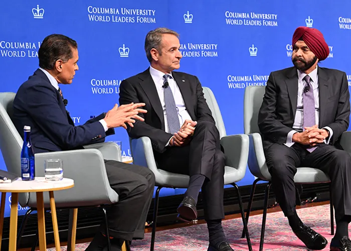 From left: Fareed Zakaria, Host of CNN's “Fareed Zakaria GPS”; Kyriakos Mitsotakis, Prime Minister of the Hellenic Republic; Ajay Banga, President of the World Bank Group, talk on panel on blue Columbia-branded stage at the 2026 Columbia University World Leaders Forum.