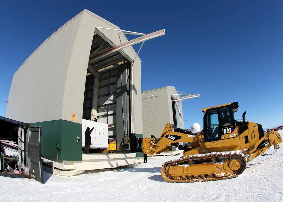  A tractor loading equipment for the GAPS project into a hangar near the McMurdo Station in Antarctica.
