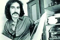 Man with a mustache in a room
