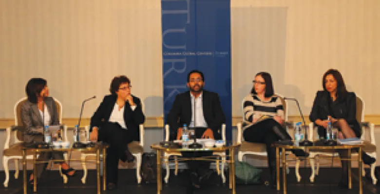 Five individuals on a panel