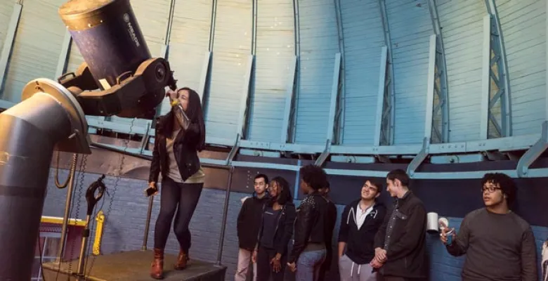 Students looking through a telescope