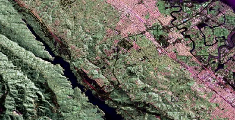 In a milestone for earthquake forecasting, researchers unveil the first physics-based model of California earthquake hazards to replicate estimates from the state’s leading statistical model. In the above radar image, a section of California's San Andreas fault can be seen below the Crystal Springs Reservoir (in black), with San Francisco (in pink) to the east. (Image: NASA Jet Propulsion Laboratory)