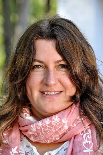 Neslihan Senocak in a pink scarf