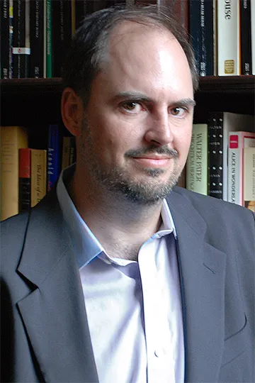 Nicholas Dames in a gray suit 
