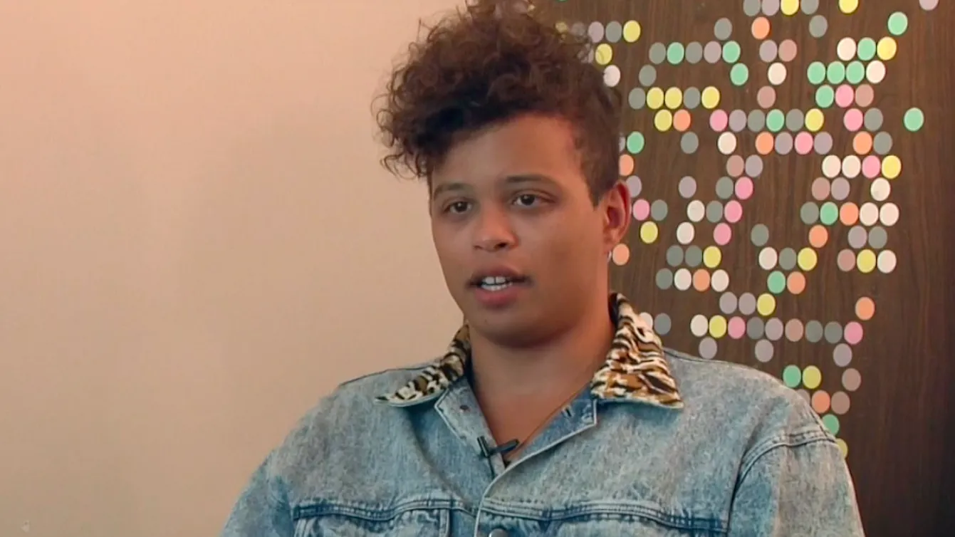 Reina Gossett in a denim jacket with a tiger fur collar