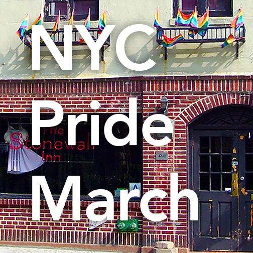 The Stonewall Inn red brick storefront with two windows on top surrounded by small rainbow flags.