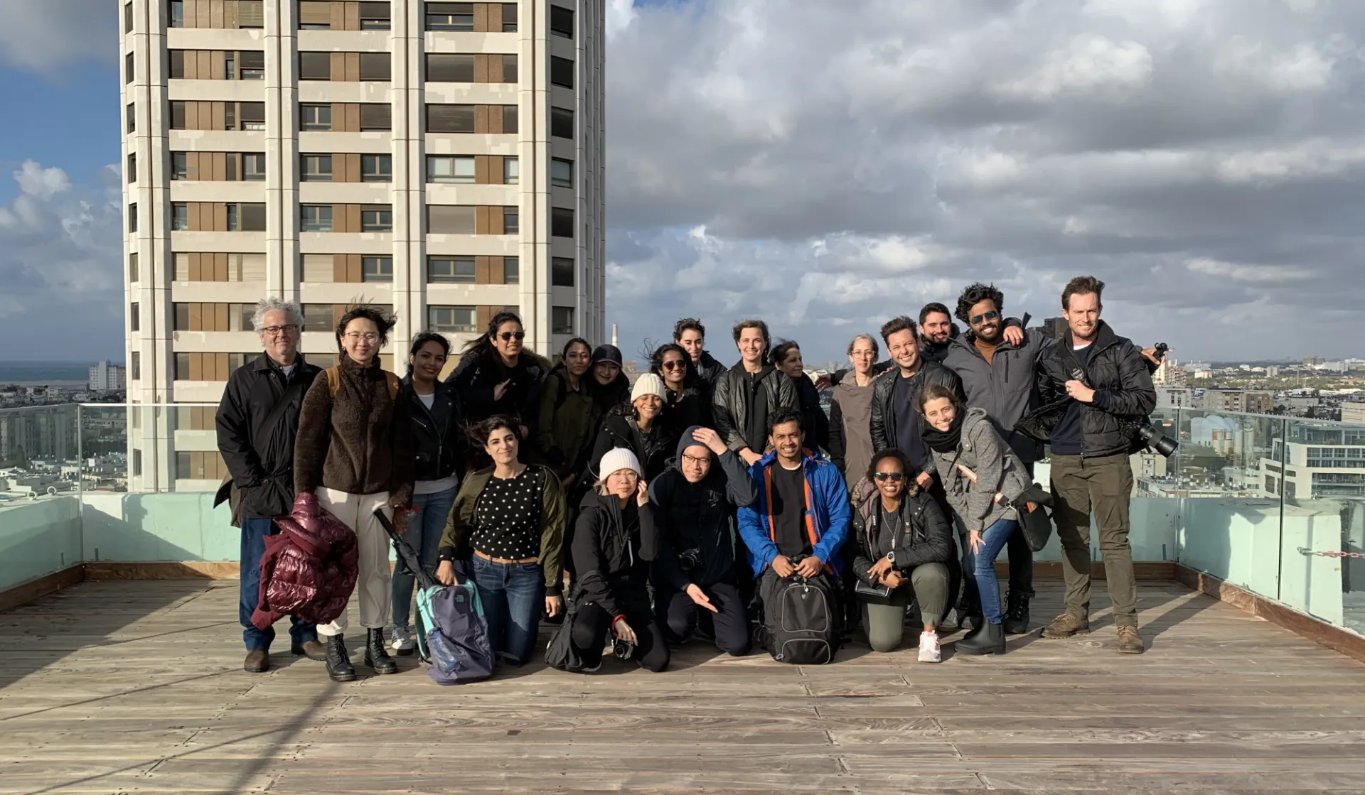 A group of people on the roof of a building.