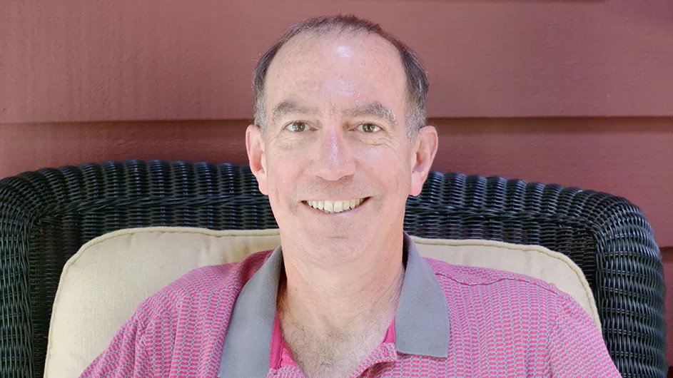 David Klass: a man smiles for the camera.