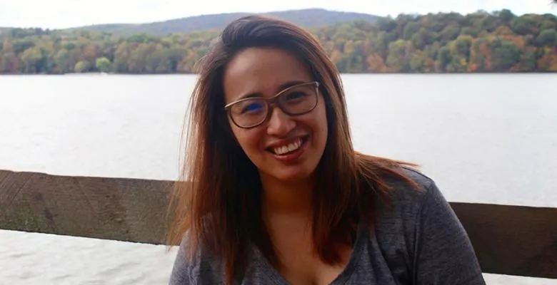 Jemima Mendoza in a t-shirt in front of a river