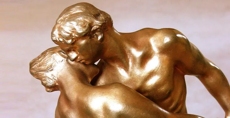 The bronze sculpture La Vaise features a man and woman embracing as the man gently lowers the woman in a lunge