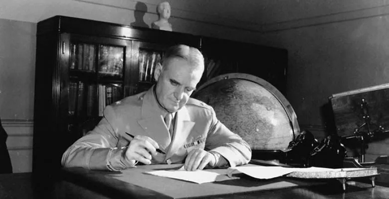 William Donovan at his desk