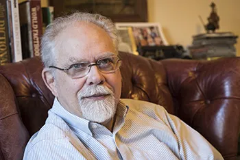 Richard Bulliet sitting in a brown leather chair