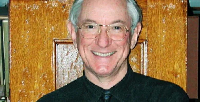 Happy man with glasses and grey hair