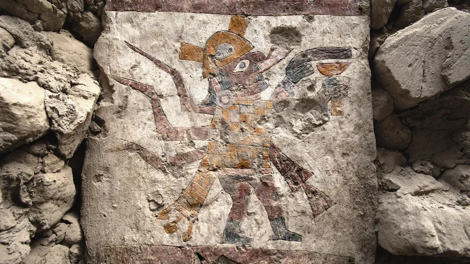 Moche figure with human body and spider features carrying a goblet, painted on a pillar within the Hall of the
Moche Imaginary. Photograph by Lisa Trever.