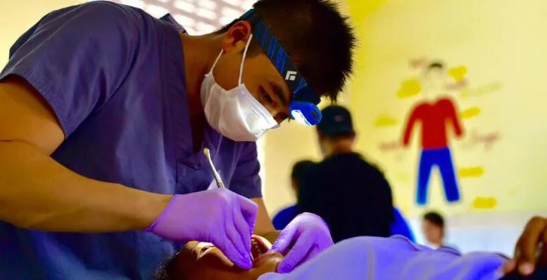 Victor Lee working on a patient