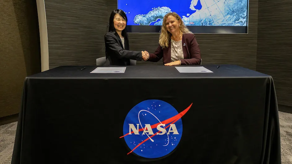 Jeannette Wing, executive vice president for research and professor of computer science at Columbia University, and Christa Peters-Lidard, director of NASA Goddard’s Sciences and Exploration directorate, at a signing ceremony on Monday, Dec. 16.