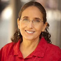 brown-haired woman with glasses and red shirt