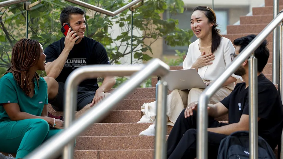 Students talk on the steps