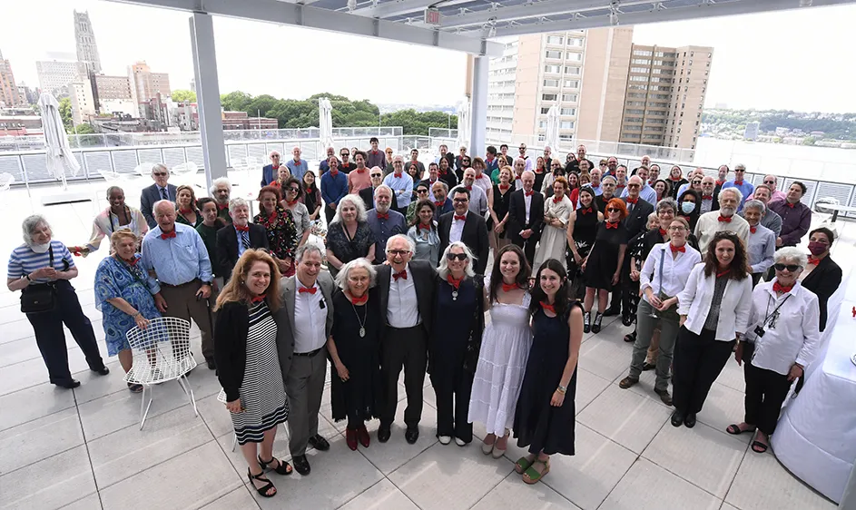 Eric Kandel, along with about 100 others, wearing red bow ties