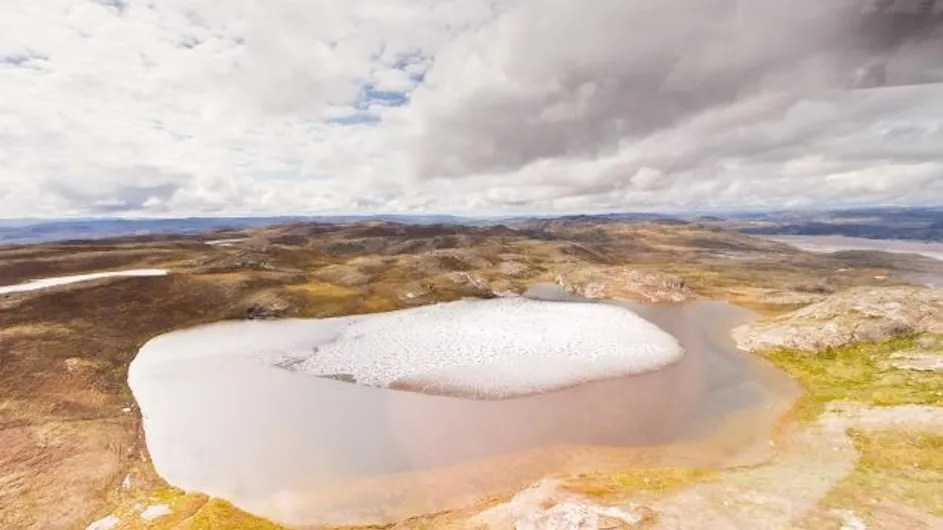 Ice melting on a pond in Greenland.