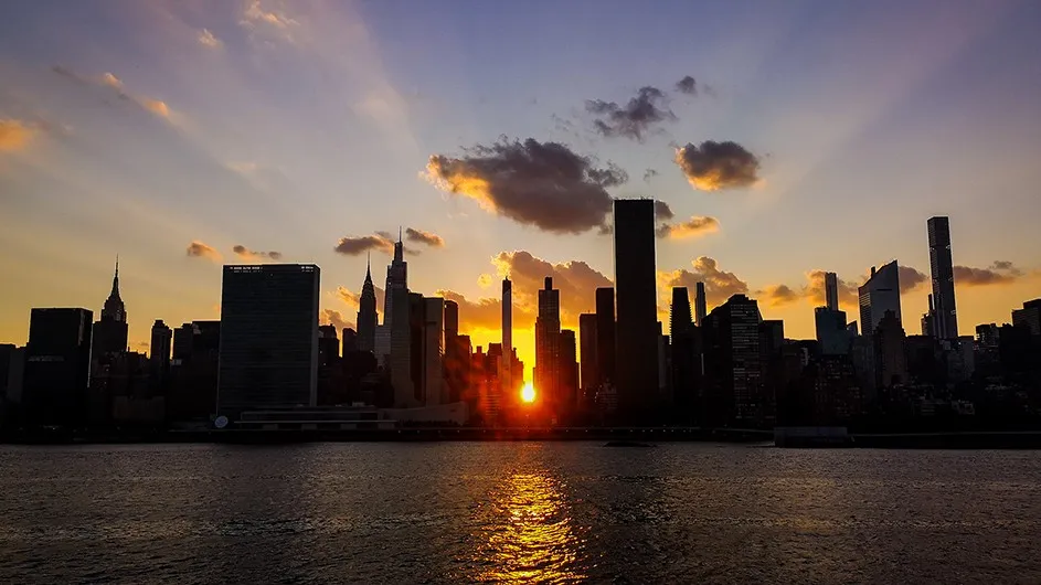 The Manhattan skyline at sunset during Manhattanhenge.